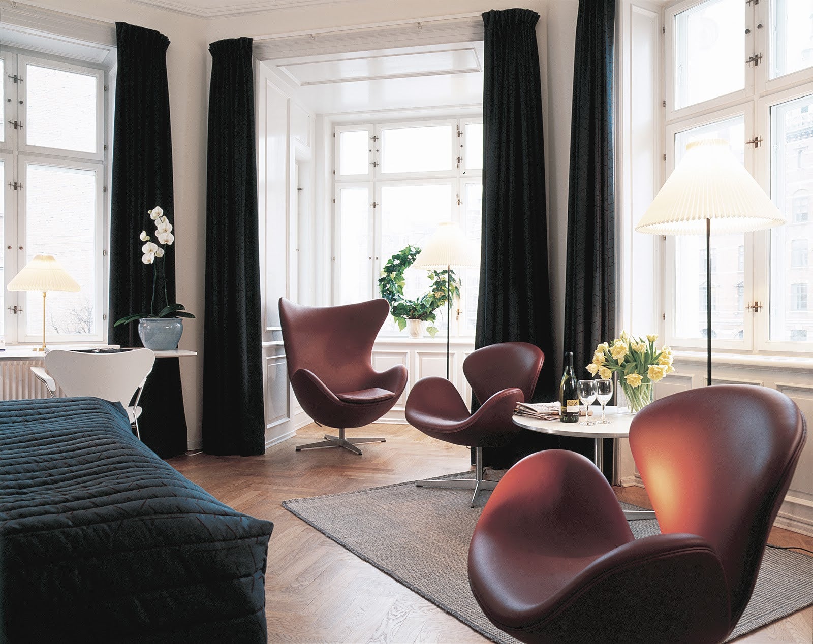 Arne Jacobsen Egg and Swan chairs, chocolate leather