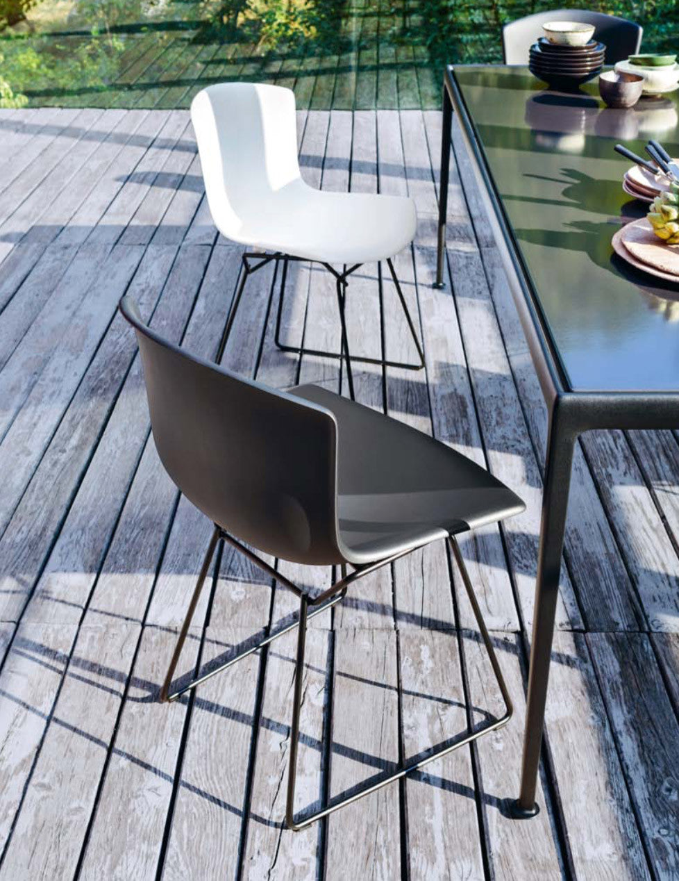 Schultz outdoor table, dark bronze porcelain top with onyx frame