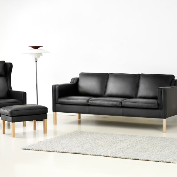 Eva sofa and Lulu armchair in black leather